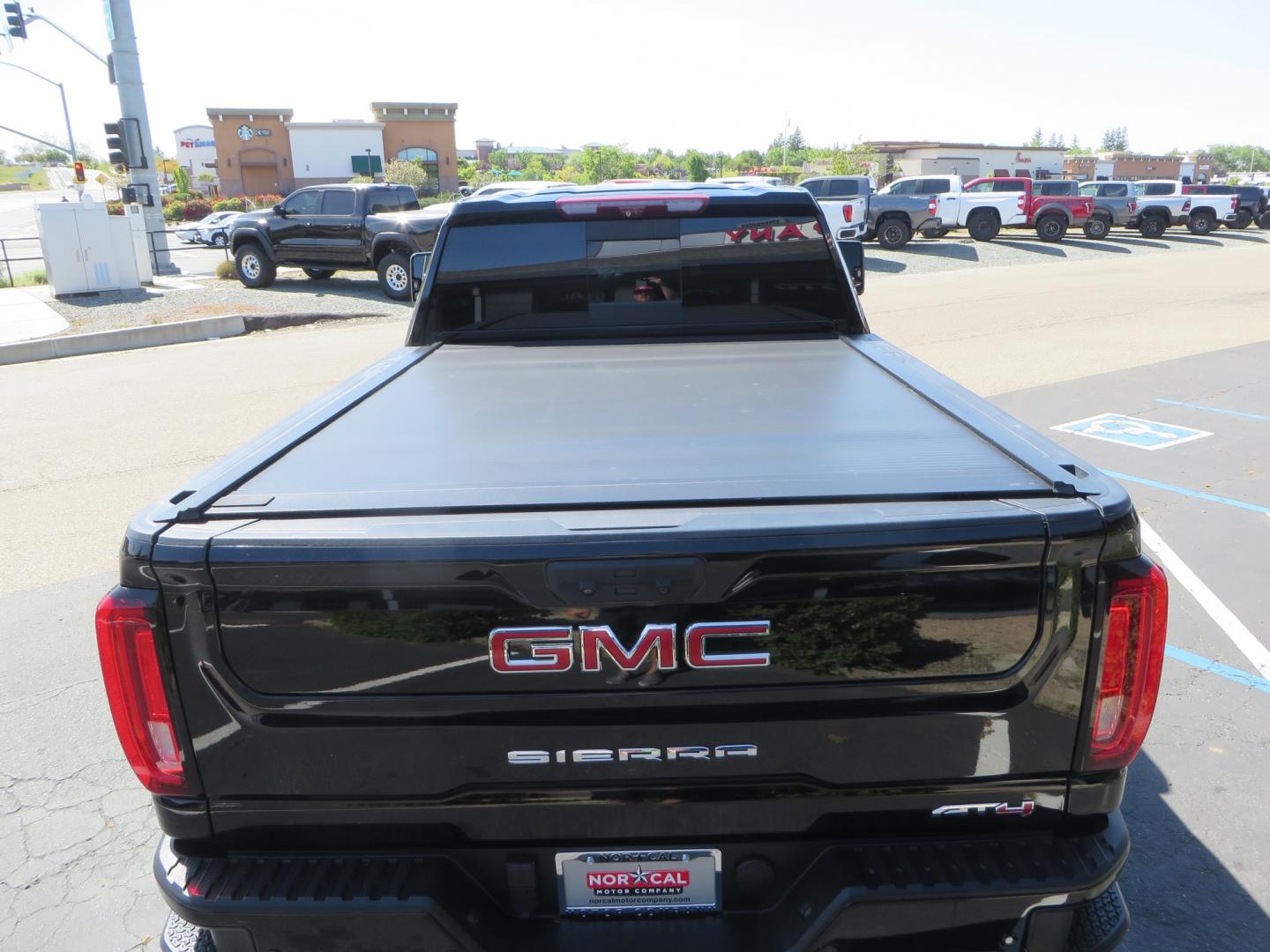 2020 BLACK /BLACK GMC Sierra 2500HD AT4 (1GT49PE76LF) with an 6.6L V8 engine, automatic transmission, located at 2630 Grass Valley Highway, Auburn, CA, 95603, (530) 508-5100, 38.937893, -121.095482 - Features a 3" BDS level kit with Fox shocks, 35" Toyo RT trail tires, 17" Method race wheels, JL audio Subwoofer, Window tint, and a power Tonneau cover. - Photo#11